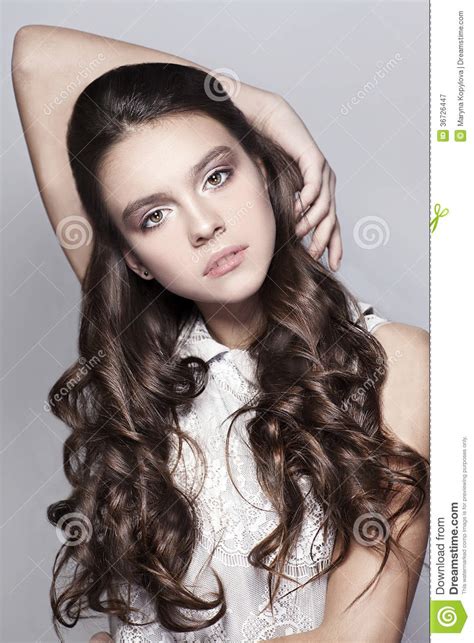 Beautiful Portrait Of Young Girl With Long Curly Hair