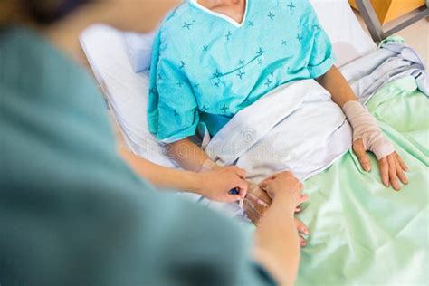 Nurse Attaching Iv Drip On Male Patient S Hand In Stock Image Image
