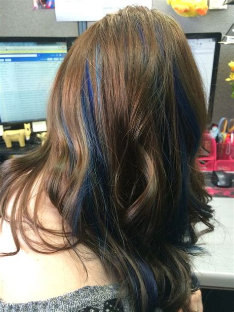 You will experience sudden urges to buy hair dye and diy it). Picture Of long chestnut wavy hair with deep blue peekaboo highlights that make it playful