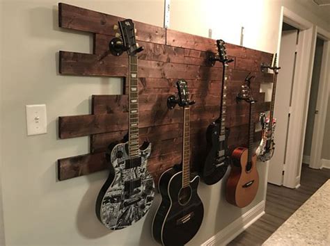 To secure the guitar hanger, you normally have to fasten it to the wall. 20 Cool Ways To Display Your Guitar Collections | HomeMydesign