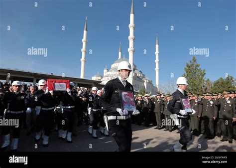 Turkish Army Officers Salute As Police Officers Carry The Coffins Of