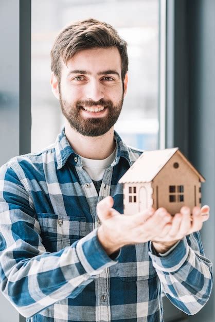 Premium Photo Cheerful Man With Toy House