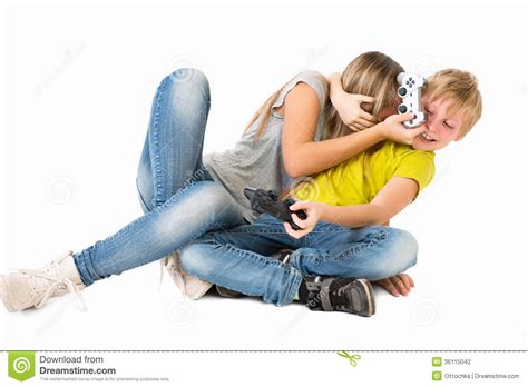 Boy And Girl Playing A Video Game And Fight Stock Photo