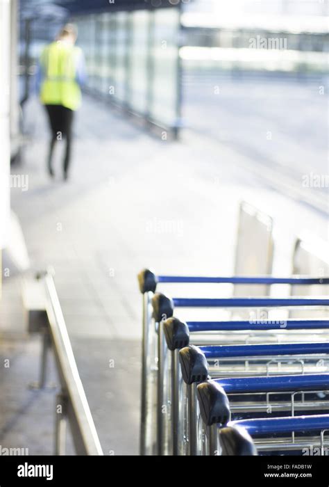Airport Luggage Trolleys To Push Baggage And Suitcases Photo Stock