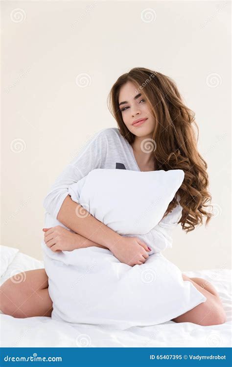 Relaxed Sensual Woman Sitting On Bed And Hugging Pillow Stock Image Image Of Caucasian Face