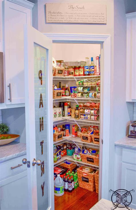 An Open Pantry Door In A Kitchen With Lots Of Food On The Shelves And
