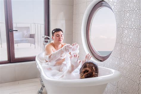 Couple In Love Fooling Around While Taking Bubble Bath Millennials