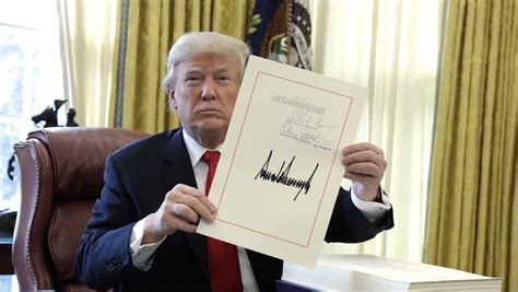 president trump signs gop s sweeping tax bill into law