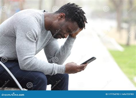 Sad Black Man Complaining Checking Mobile Phone Stock Photo Image Of Checking Disaster