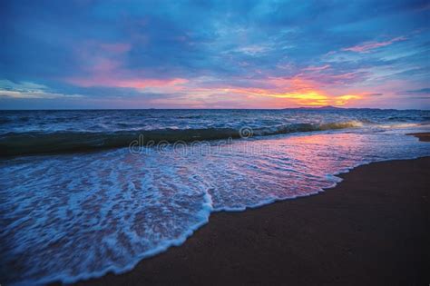 Sunset On The Beach Beach With Waves At Dusk Stock Photo Image Of