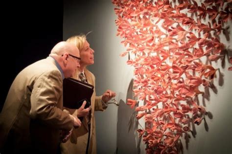 surreal man bursts into 1500 ceramic flowers