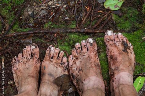 Dirty Feet On Moss In Jungle Walking In The Tropical Rain Forest