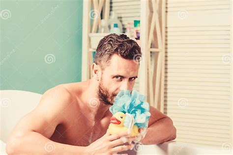 macho naked in bathtub funny duckling playful mood macho enjoy bath man in bathroom stock