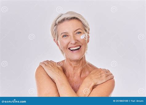 Portrait Of One Happy Mature Caucasian Woman Posing Topless Against A Purple Copyspace
