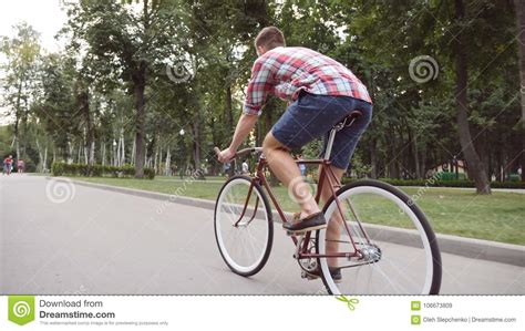 Young Man Riding Vintage Bicycle At The Park Alley Sporty Guy Cycling