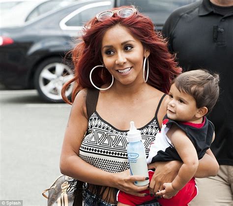 snooki s one happy momma reality star can t stop smiling as she takes little lorenzo out for a