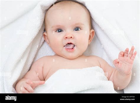 Cute Smiling Baby Portrait Lying On Bathing Towel Stock Photo Alamy