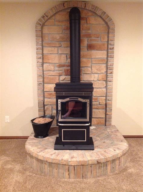 Wood Burner In Living Room With Brick Hearth And Stone Arch
