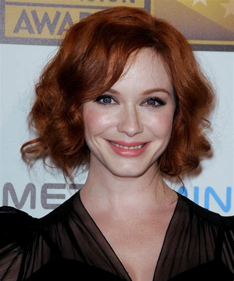 christina hendricks long curly dark copper red updo hairstyle with side swept bangs