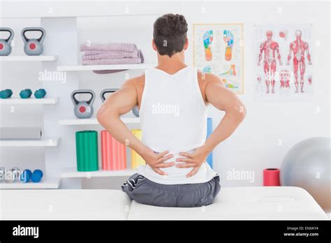 Young Man Suffering From Back Pain Stock Photo Alamy