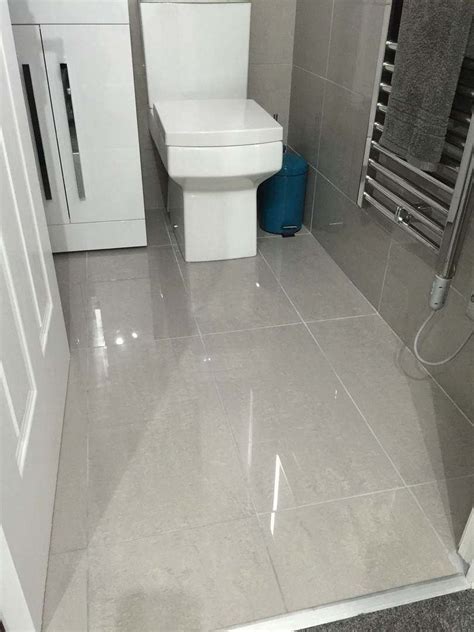 Bathroom tile ideas give an excellent look to the shower wall. Doblo Light Grey Polished Porcelain | Porcelain tile ...