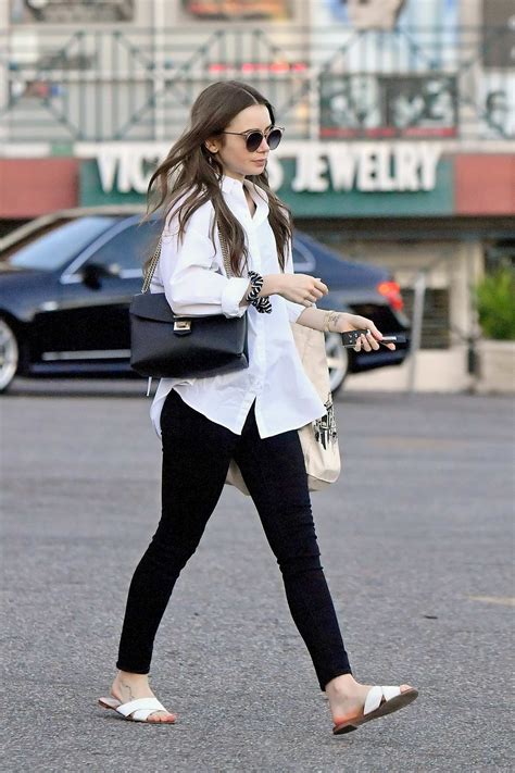 Lily Collins Keeps It Casual With A White Shirt And Black Jeans While Out Shopping In West