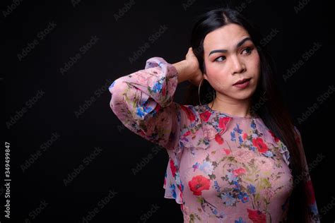 Young Beautiful Asian Transgender Woman Against Black Background Stock