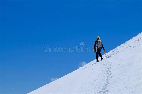 Man Climber On Steep Snow Mountain Slope Stock Image Image Of Helmet