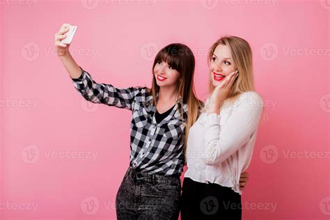 Two Pretty Girls Making Self Portrait By Mobile Phone Smiling Having