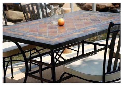 This minimalist dining table blends a resilient aluminum base with a composite wood surface, creating both a mixed material look and a nod to classic outdoor designs. STONE GARDEN PATIO MOSAIC SLATE TABLE 78"-MAPLE ...