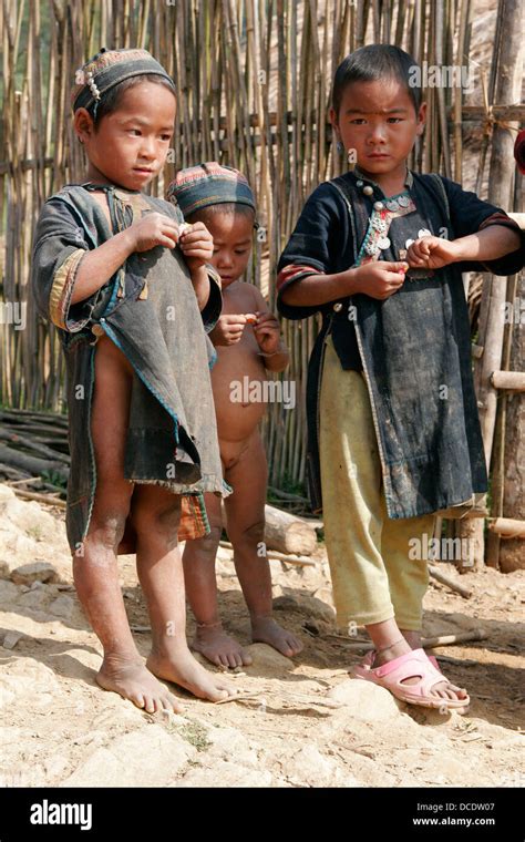 Ethnic Akha Children Wearing Traditional Clothes In Tribal Village Near