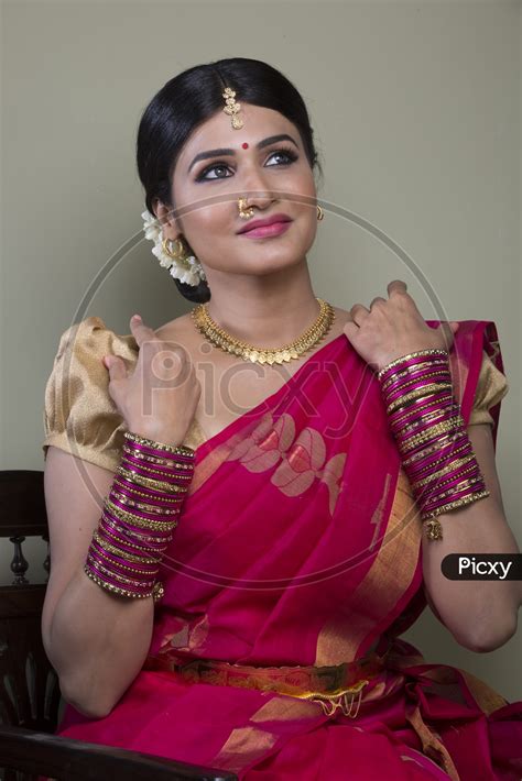 Image Of A Beautiful Indian Female Model In Traditional Attire Wearing A Saree And Jewelry With