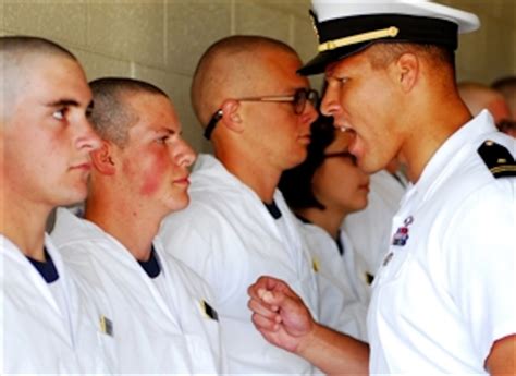 A Us Naval Academy Upper Class Midshipman Instructs A Plebe