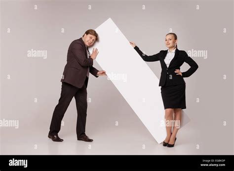 Business Man And Woman Standing Over Blank Banner Stock Photo Alamy