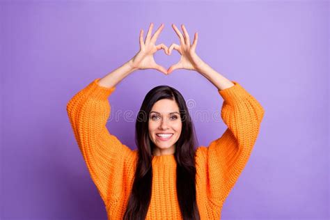 Photo Portrait Of Brunette Girlfriend Showing Heart Symbol Of Love Over Head Smiling Isolated On