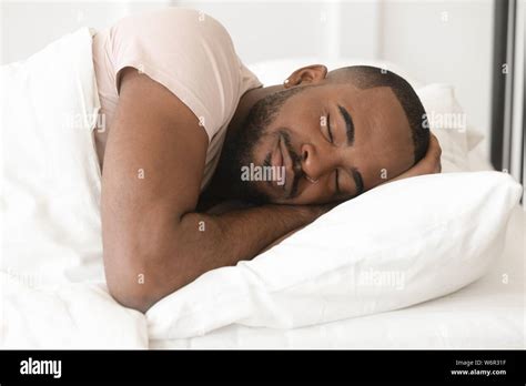 Serene Calm Young Black Man Sleeping Well Alone In Bed Stock Photo Alamy