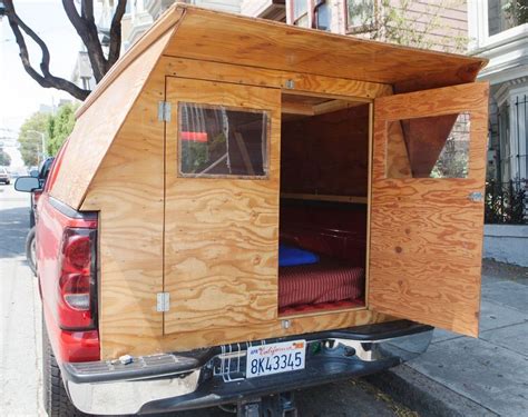 There are six or eight bolts that are hooked to the frame rails. Man Designs/Builds Wooden Micro Truck Camper