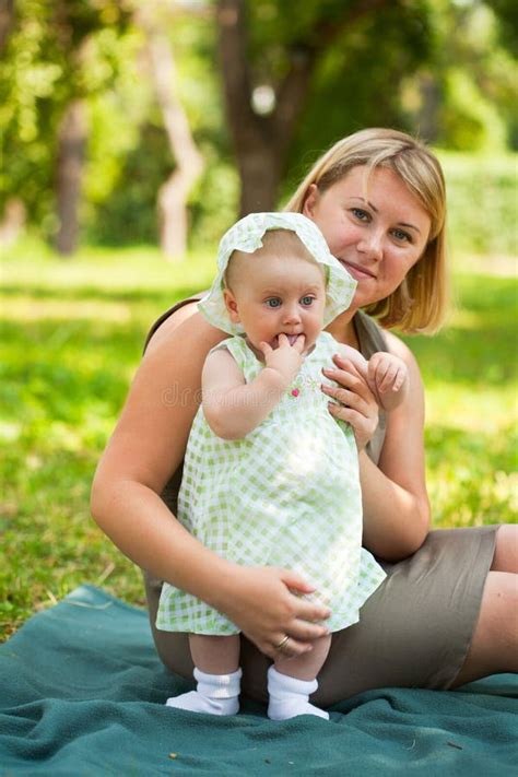 Young Mum Walks With The Child Stock Image Image Of Cuddling Grass