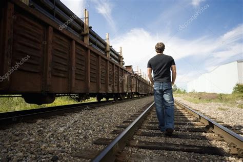 Walking On The Railroad Tracks Stock Photo By ©designpicsinc 31719393