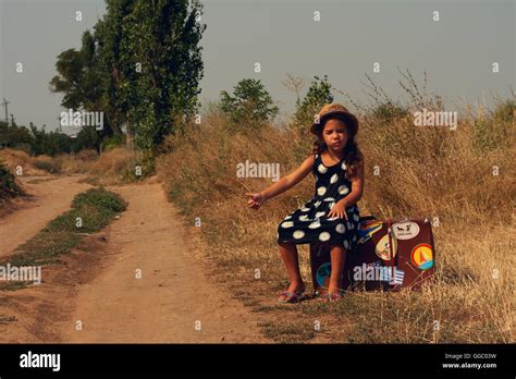 Girl With Suitcase Stock Photo Alamy