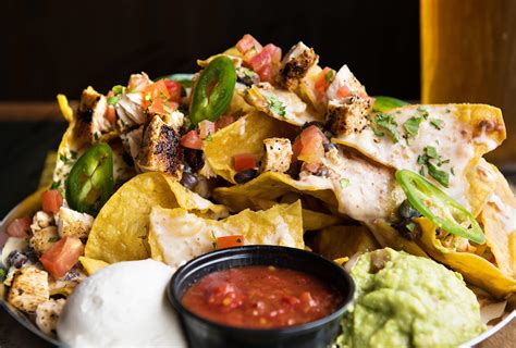 Cheesy nachos are the perfect sharing dish for party season. The 5 best nachos in Nashville - M.L.Rose Craft Beer & Burgers