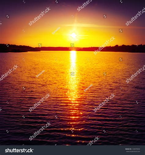 Colorful Sunset Over Water Surface Stock Photo 129079934 Shutterstock