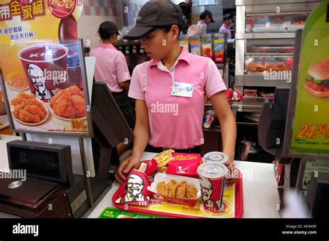 A Kfc Girl Staff Serves Clients In Tianjin China 19 Aug 2007 Stock