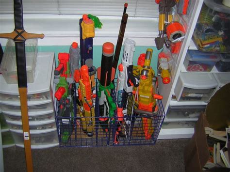 The rack holds several nerf guns (long guns and pistols) and a lot of ammo. Nerf storage ideas! - A girl and a glue gun