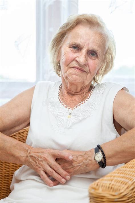 Portrait Of An Elderly Lady Sitting In A Chair Stock Photo Image Of Home Woman