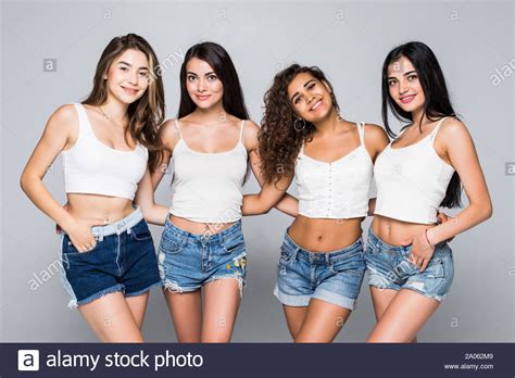 Group Of Beautiful Women Smiling Isolated Over A White Background Stock