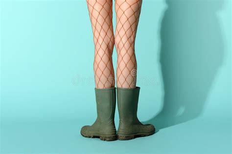 Woman In Fishnet Pantyhose And Rubber Boots Stock Image Image Of