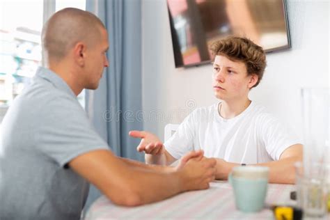 sit down conversation of dad and son stock image image of caucasian indoors 231038853