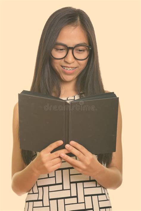 Nerdy Cute Student With Braces Carrying Her Books Stock Photo Image