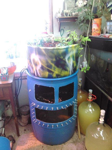 There Is A Large Potted Plant On Top Of A Blue Container In The Middle